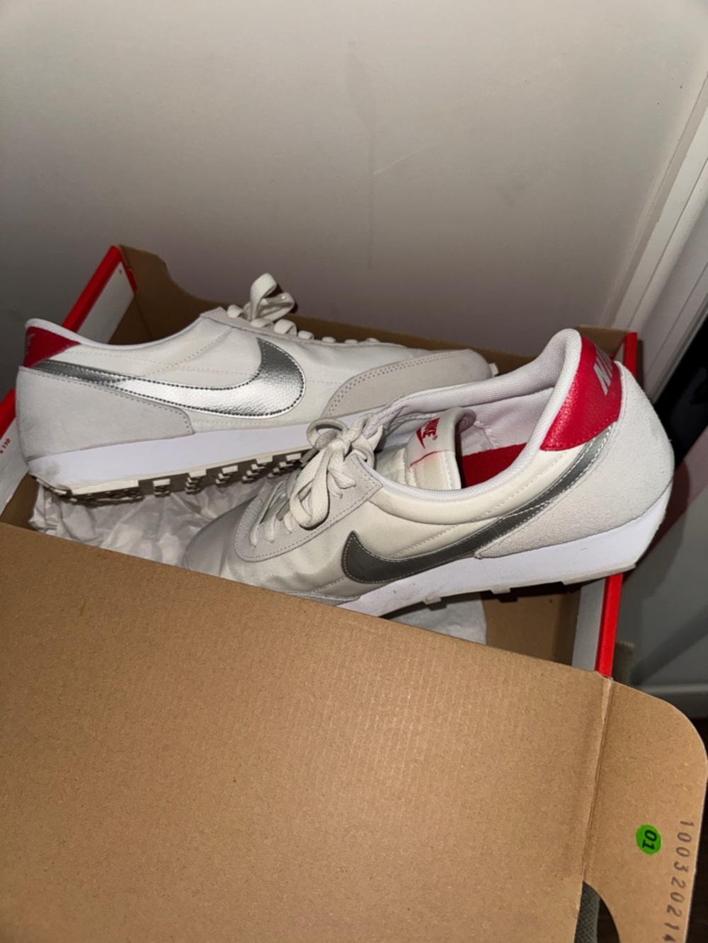 Nike Women's White Sneakers with Silver Swoosh and Pink Heel Tab